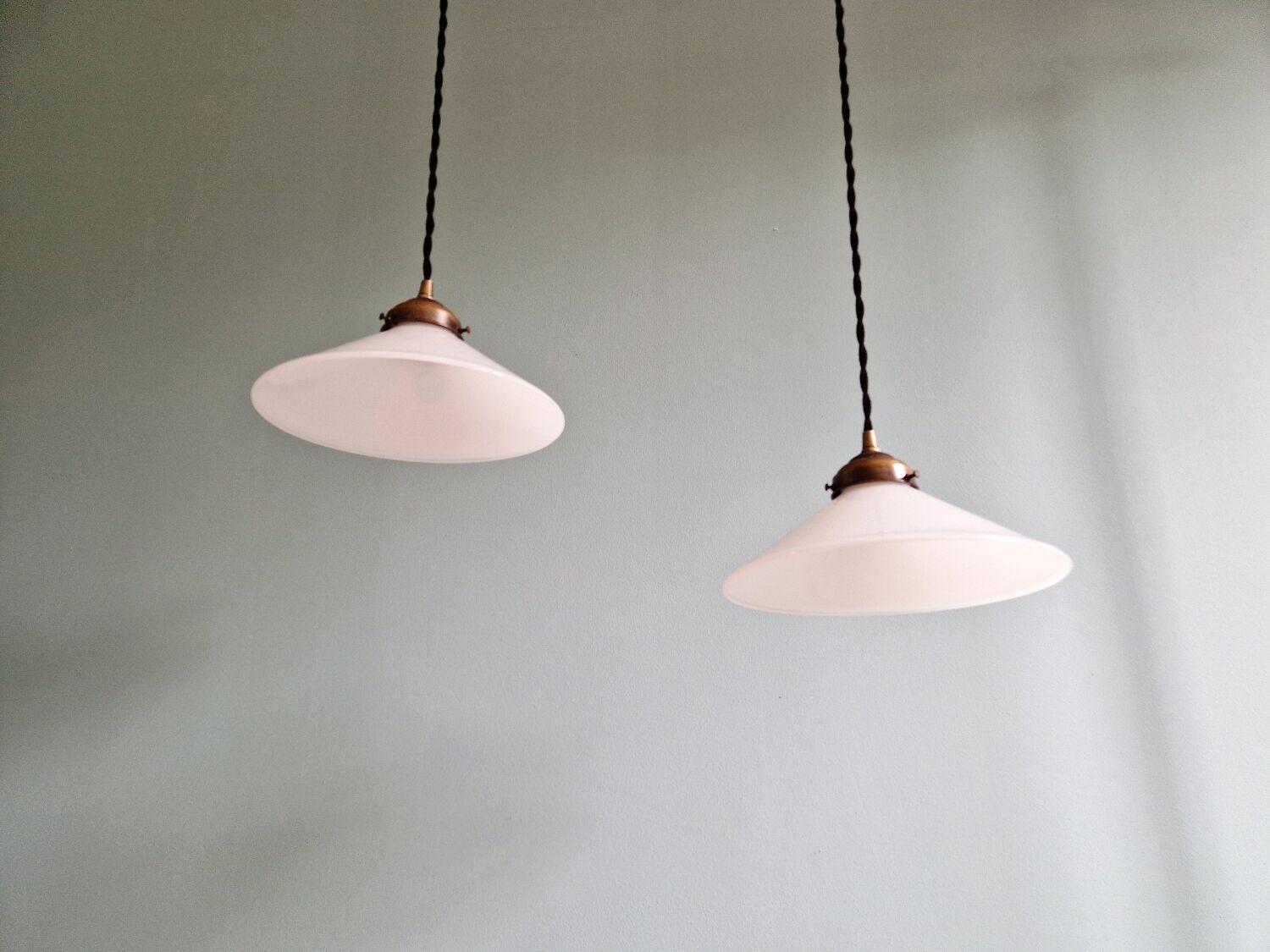 Pair of Art Deco conical white opaline pendants, 1920-30.