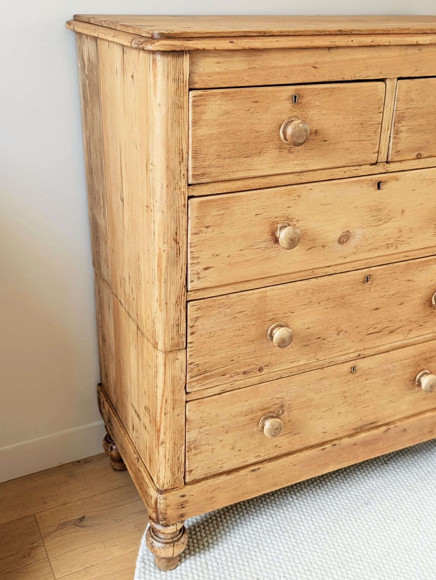 Large renovated antique English chest of drawers in solid pine.