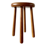 Old solid wood stool with four legs