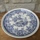 Old ceramic plate with scene of life and blue floral decor Van Melle