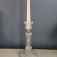Old candlestick with molded glass stamps