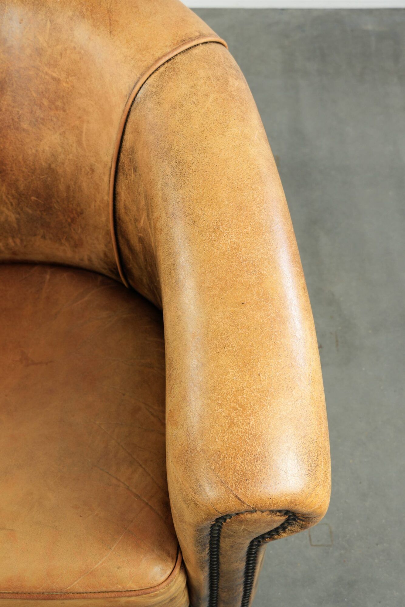 Vintage sheepskin club armchair in a light cognac colour