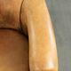 Vintage sheepskin club armchair in a light cognac colour