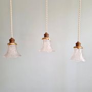 Art Deco trio of pendant lights/table lamps in clear glass, 1920s-30s.