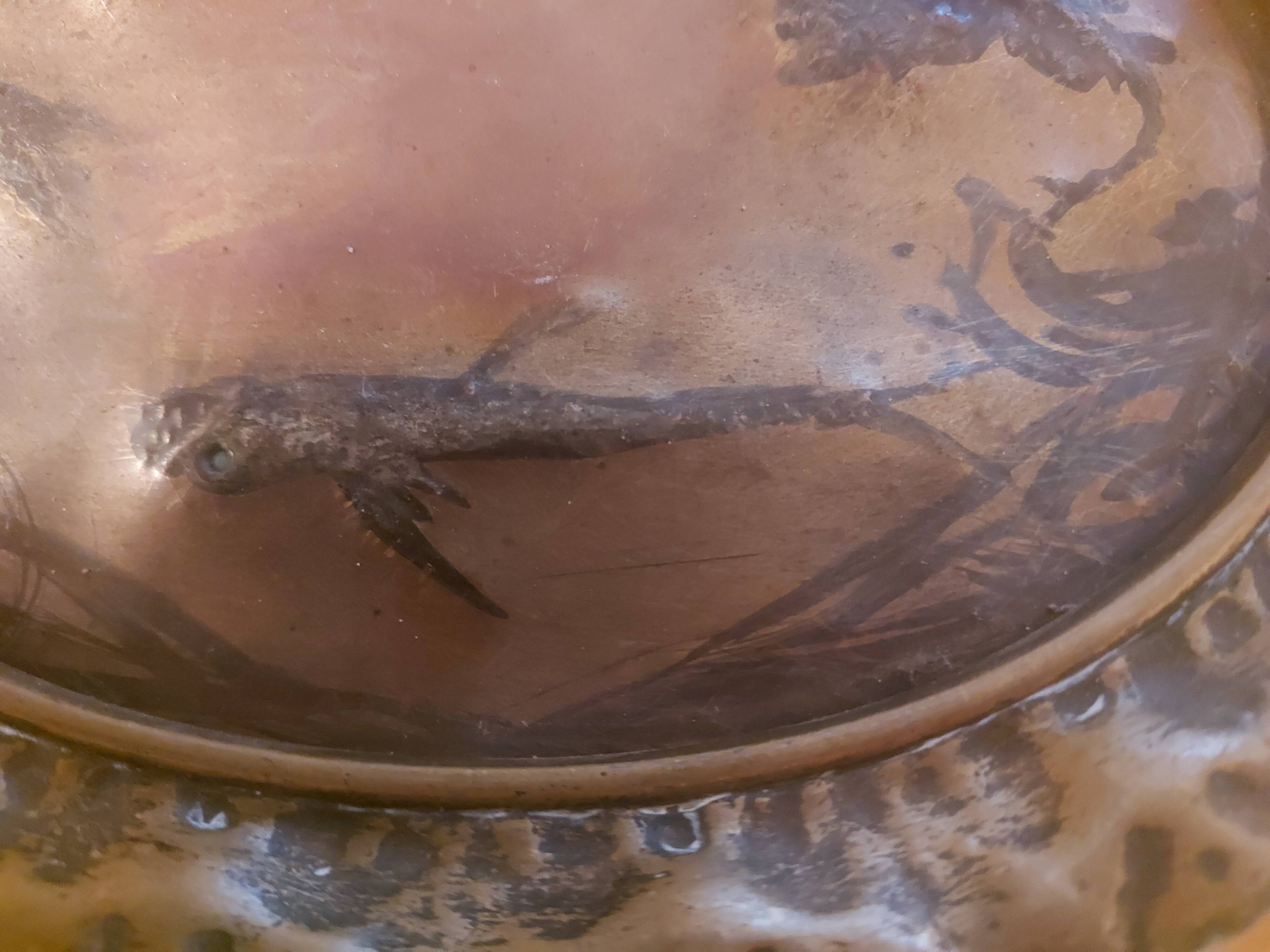Decorative copper repoussé plate with marine motifs