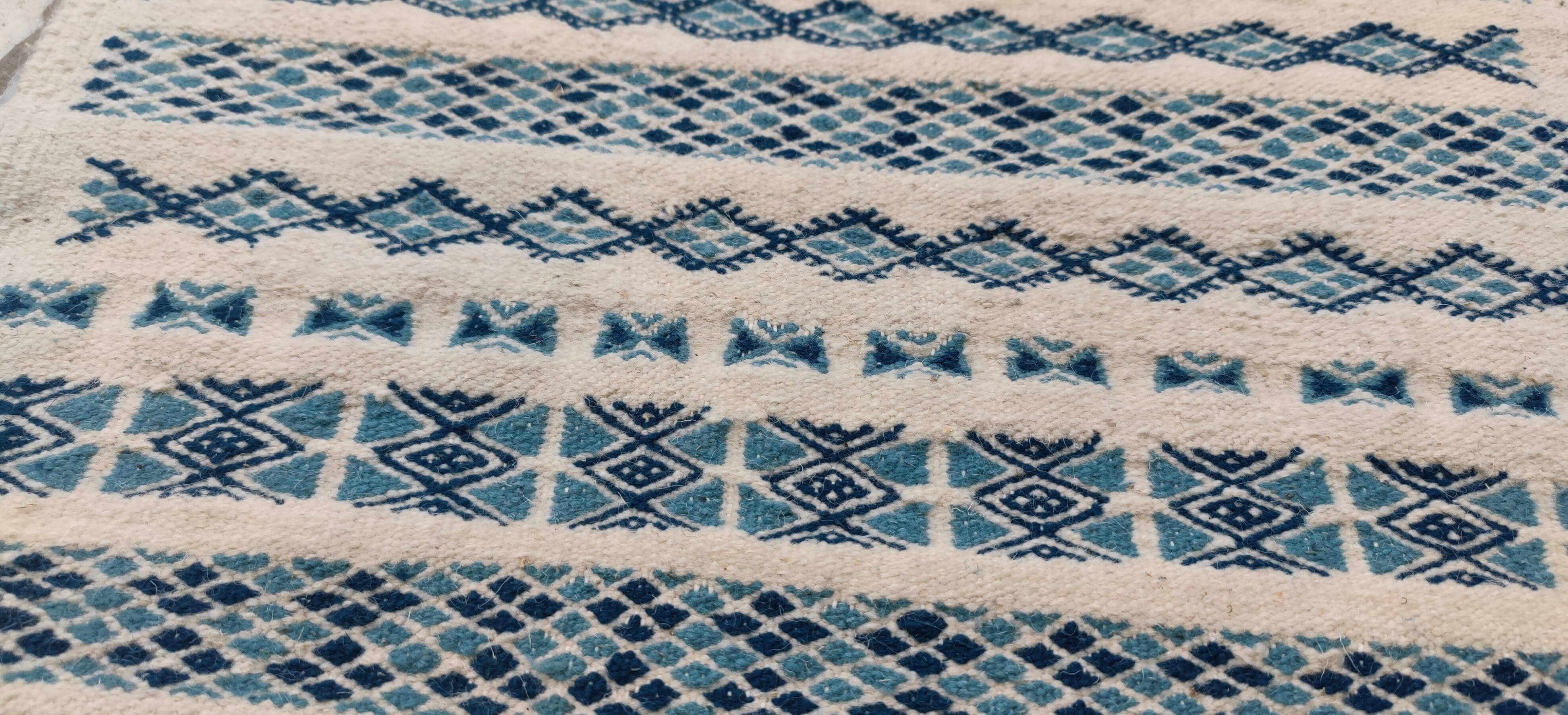 Traditional handmade white and blue carpet