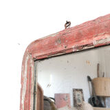 Old mirror in red wood