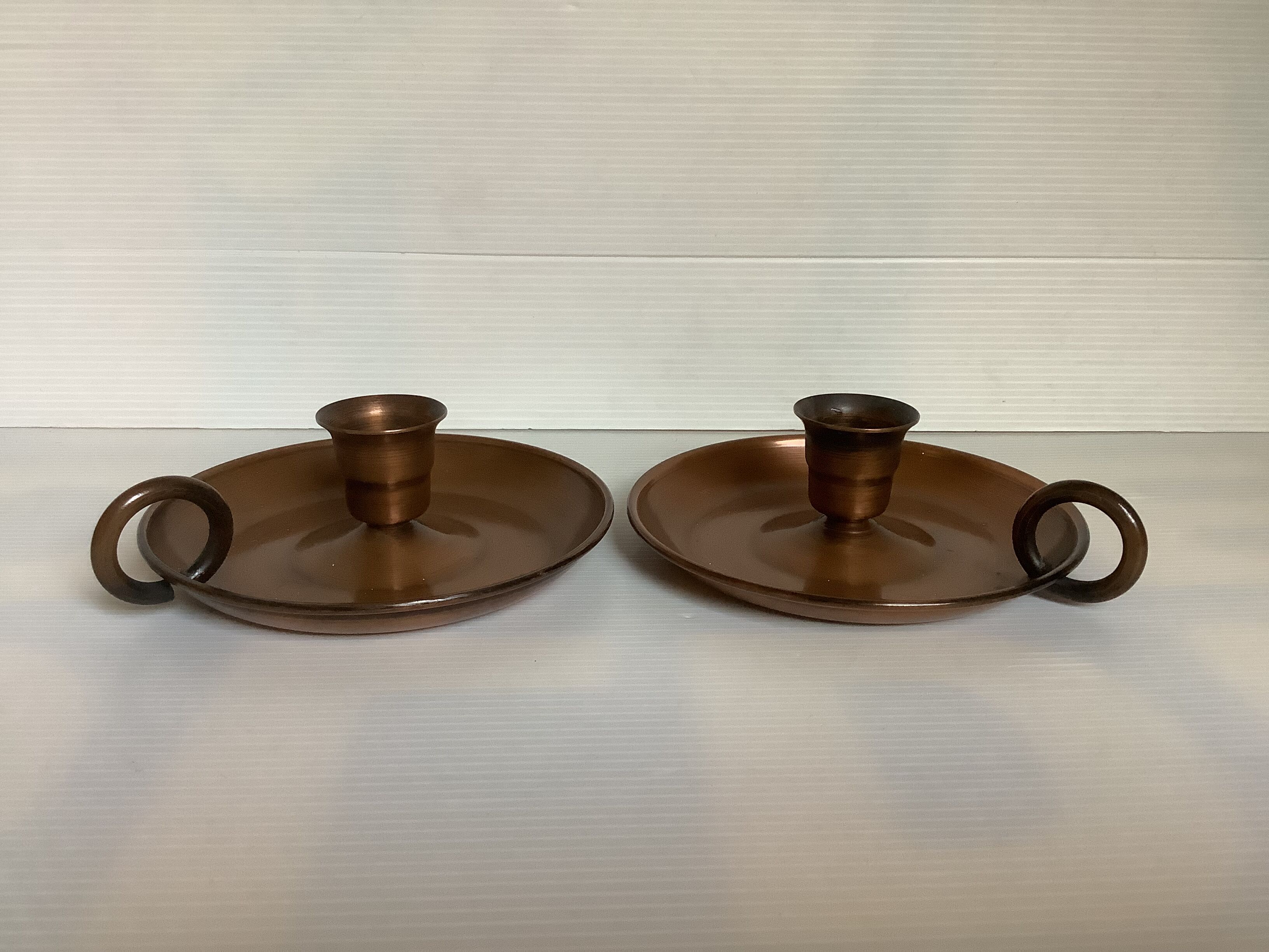 Pair of old copper candlesticks, rat of the cellar.
