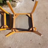 3 vintage bridge chairs with rounded armrests.