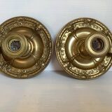 Pair of brass cellar rat candlesticks mascarons