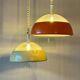 Pair of glass and holophane metal pendant lights, 1970s