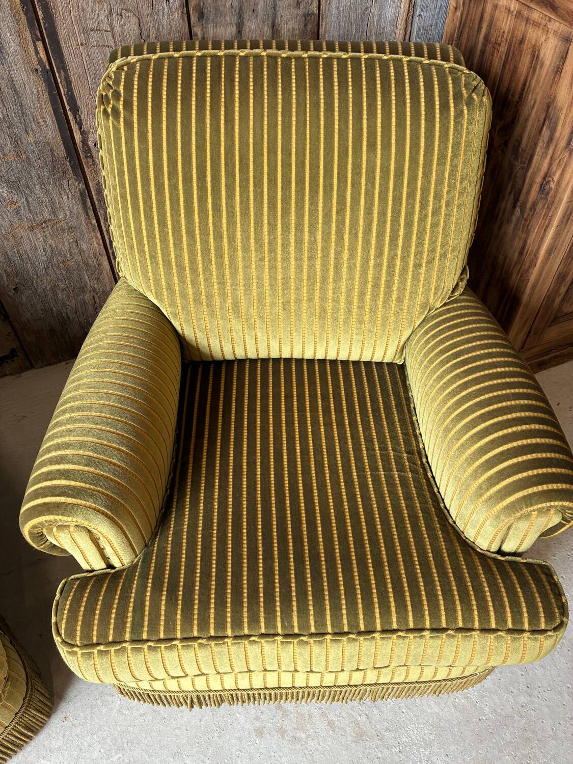 Pair of green recliner chairs