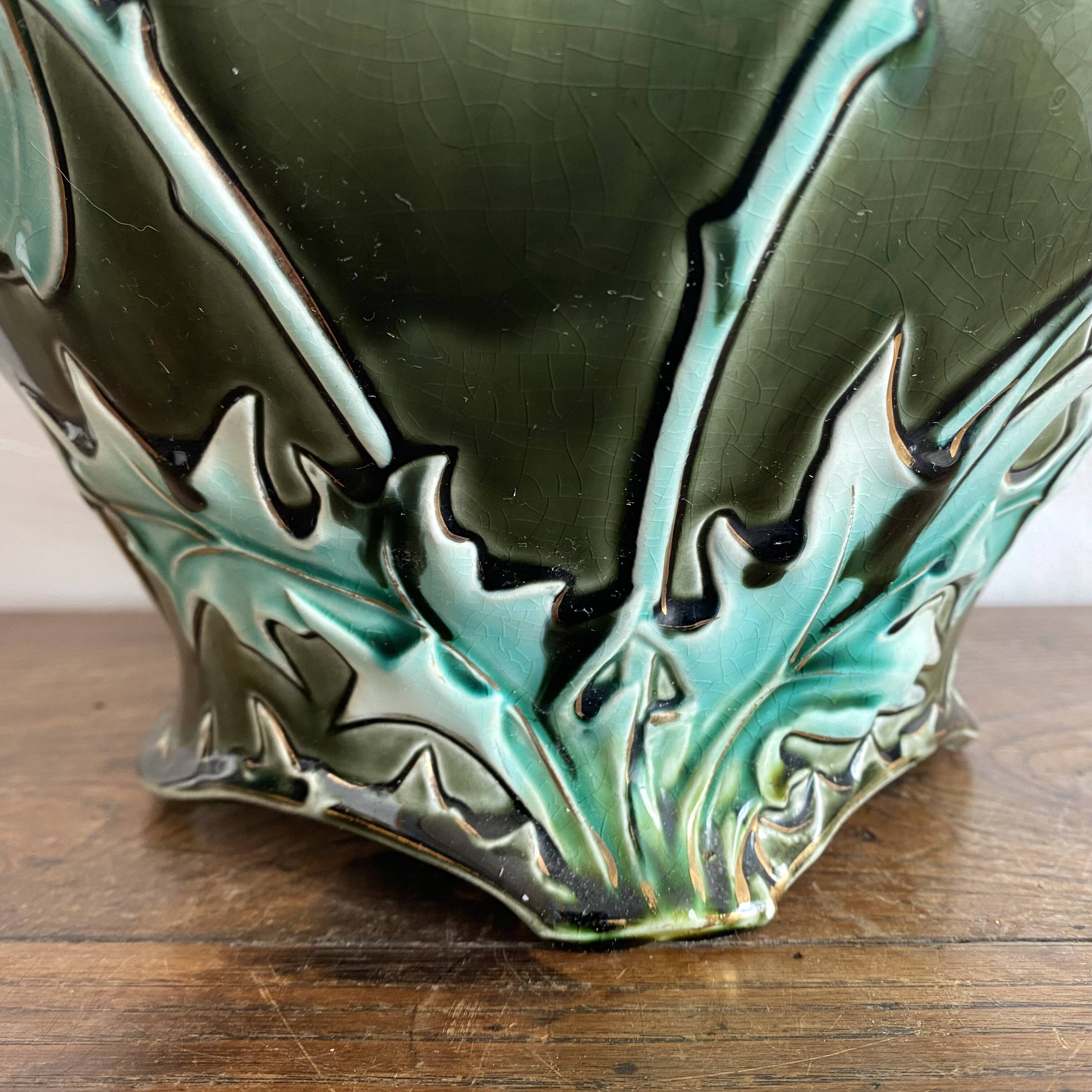 Large earthenware cache-pot in Art Nouveau style, decorated with thistles.