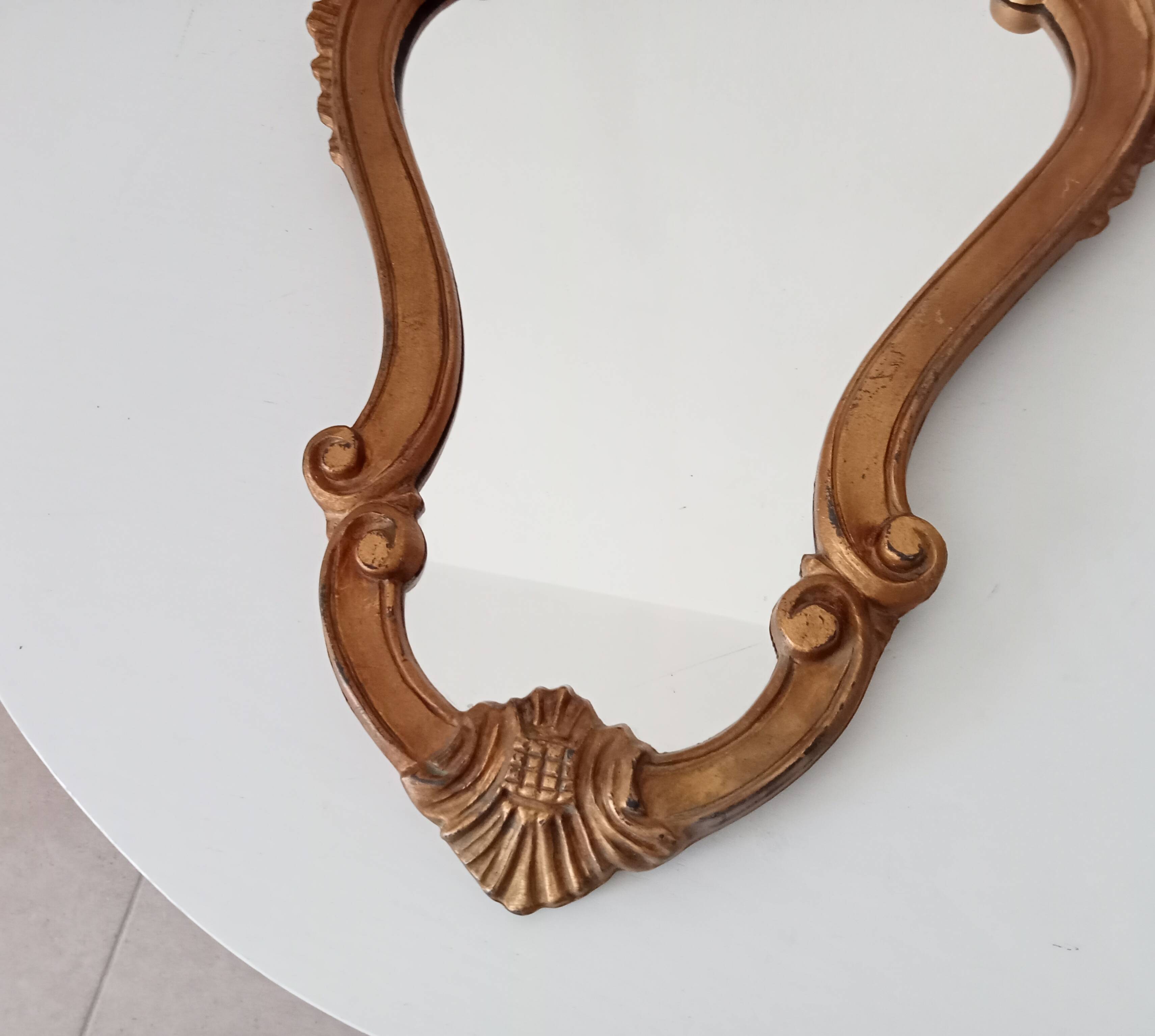 Italian baroque mirror in gilded resin from the 60s