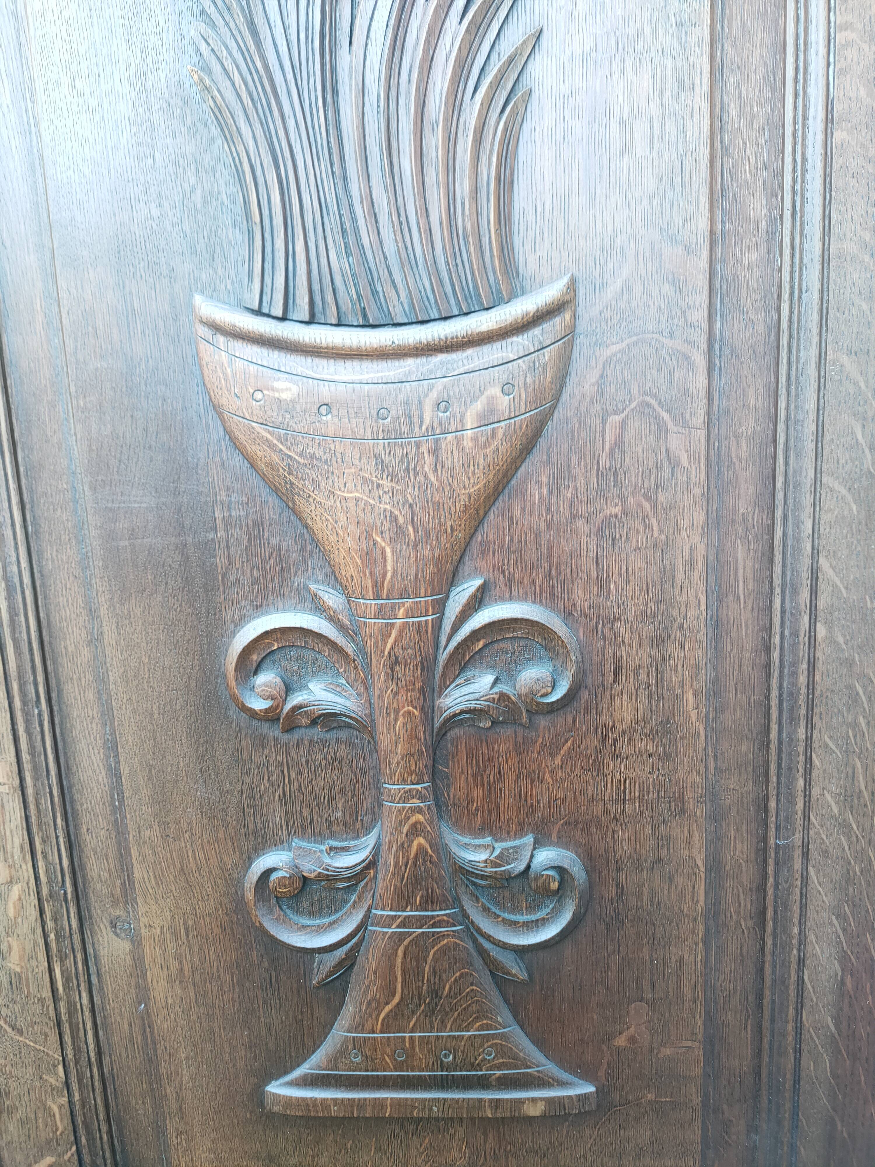 pair of antique solid oak cabinet doors with bird decor