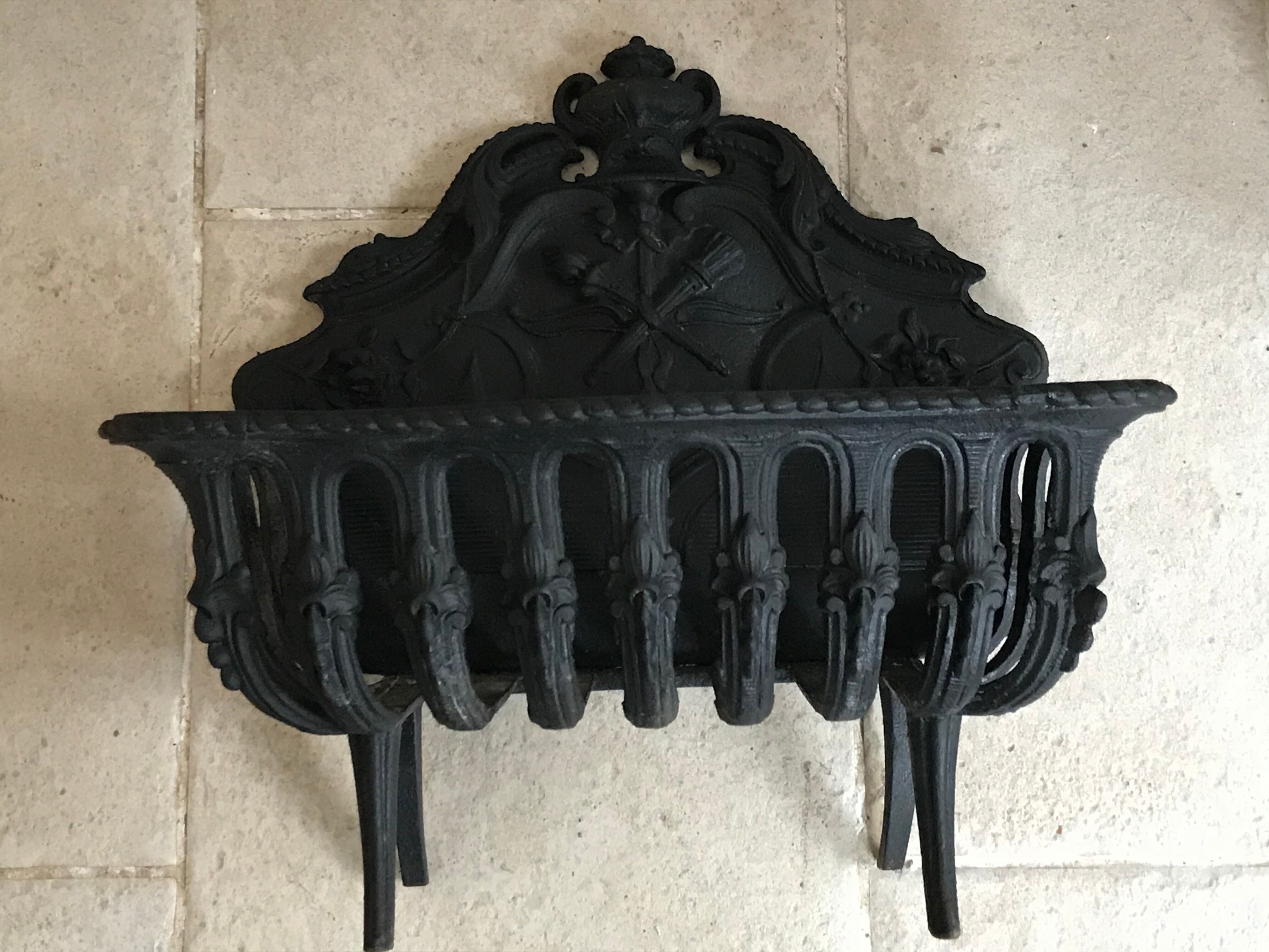 Cast iron fireplace cradle log holder