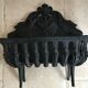 Cast iron fireplace cradle log holder