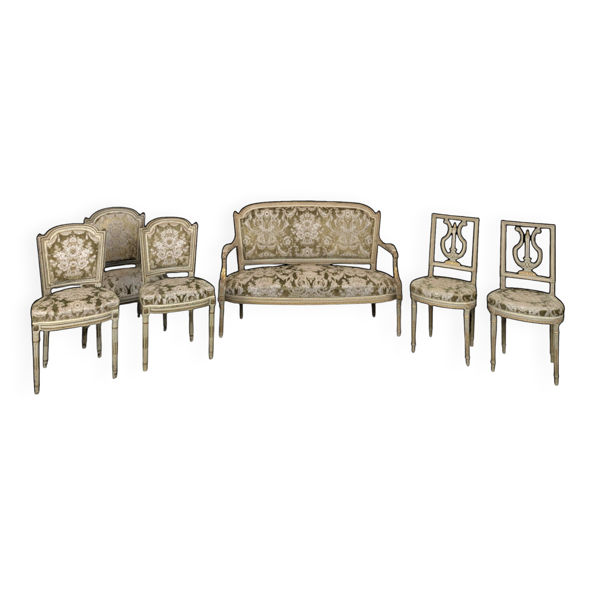 Cream lacquered Louis XVI style cabriolet salon with gold highlights.