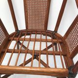 Rattan armchair with its footrest 70s