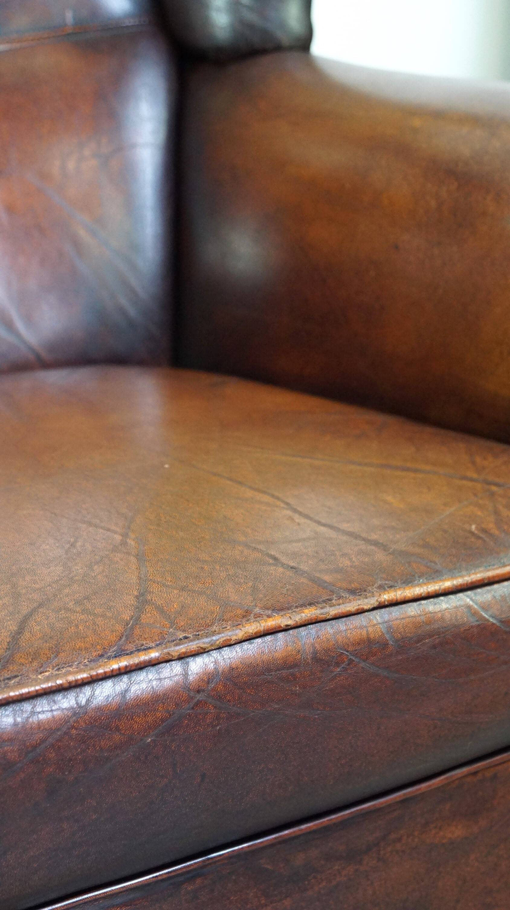 Luxurious sheepskin armchair with a fixed seat cushion and high seating comfort