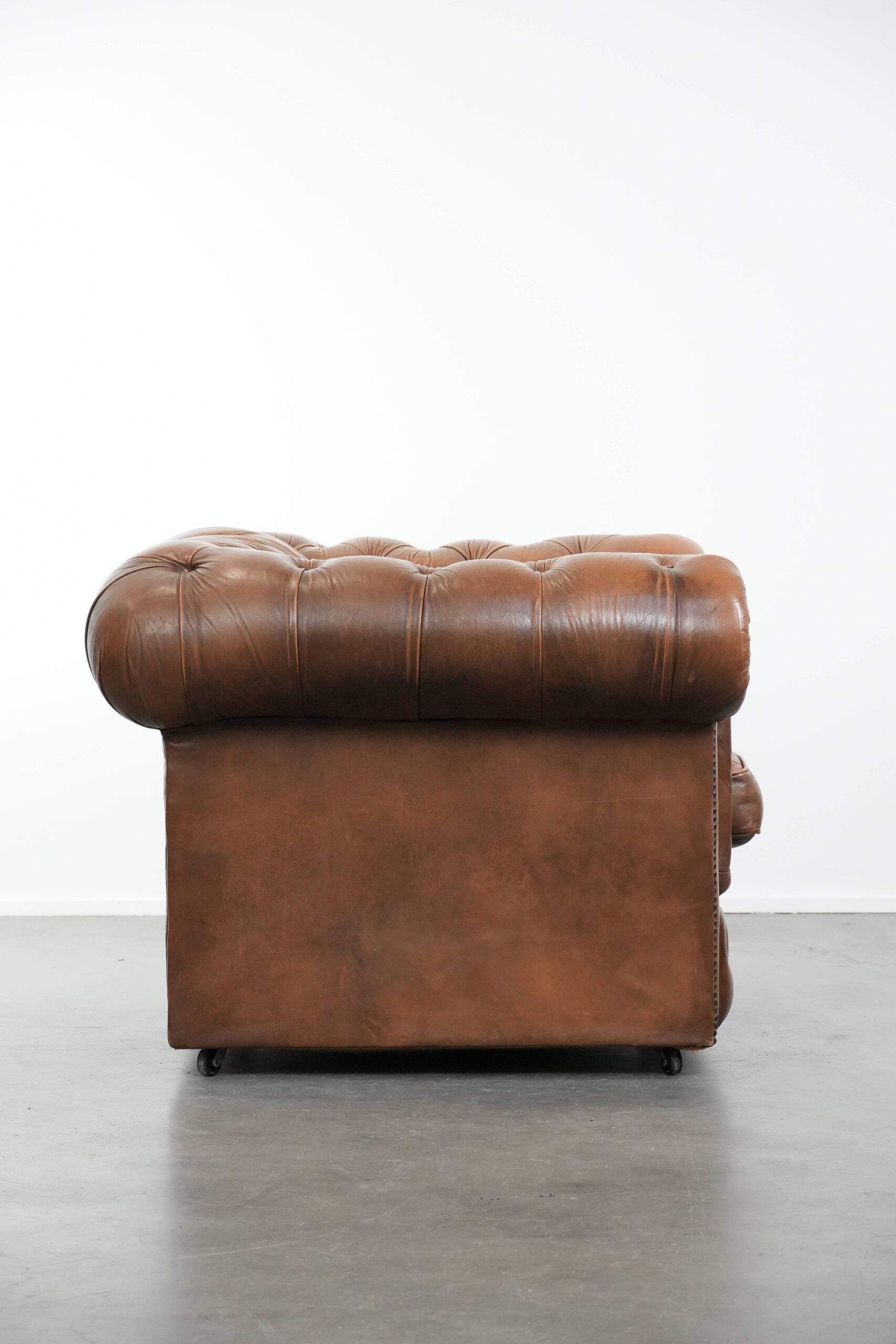 Brown cowhide leather chesterfield armchair  in English style on wheels