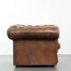 Brown cowhide leather chesterfield armchair  in English style on wheels