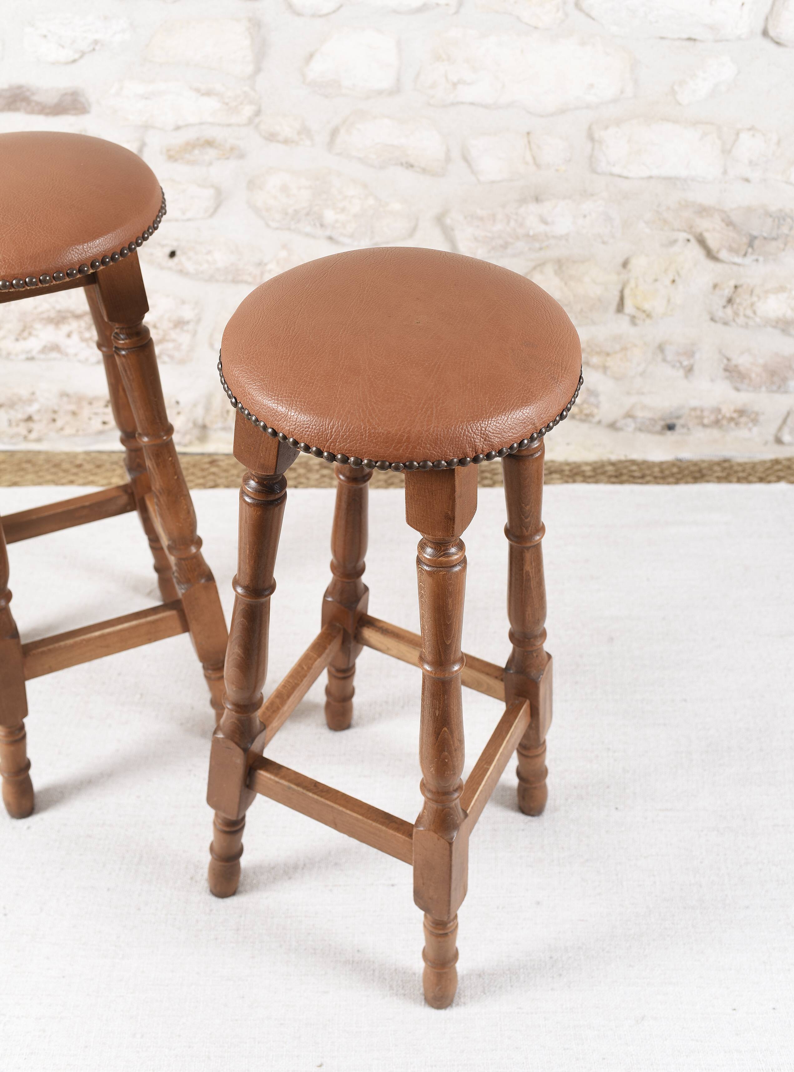Antique bar stools, brown leather and wood