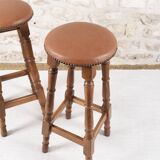 Antique bar stools, brown leather and wood