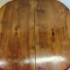 Oval wooden table with extensions