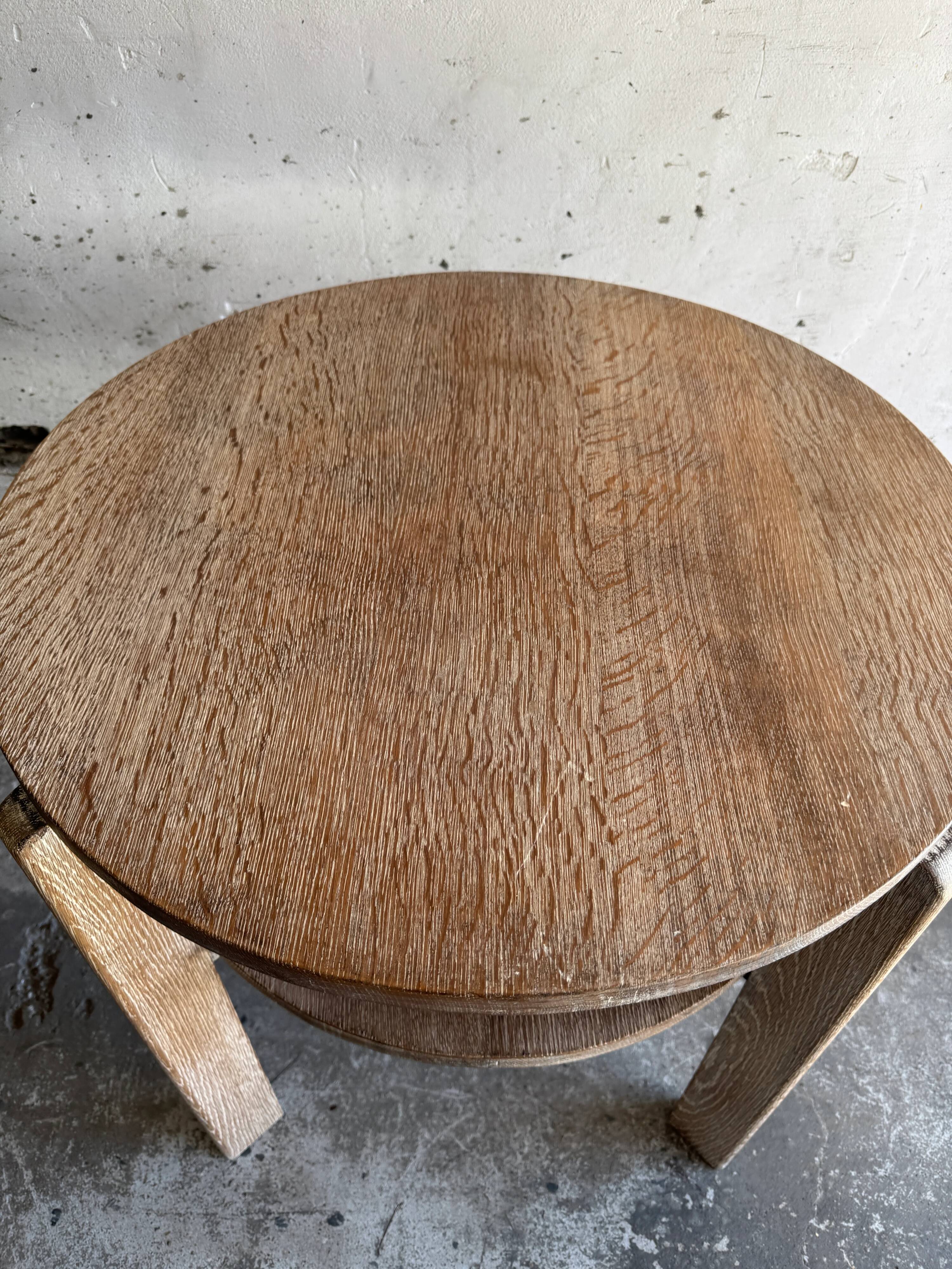 Art Deco round oak side table in light weathered oak with lower shelf, geometric three-leg design