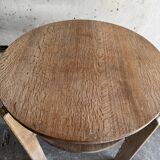 Art Deco round oak side table in light weathered oak with lower shelf, geometric three-leg design