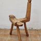 Brutalist chair in solid wood, European handcrafted work from the early 20th century.