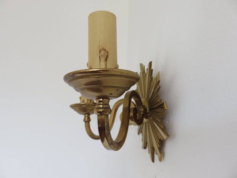 Wall lamp "little sun" in 70s golden brass