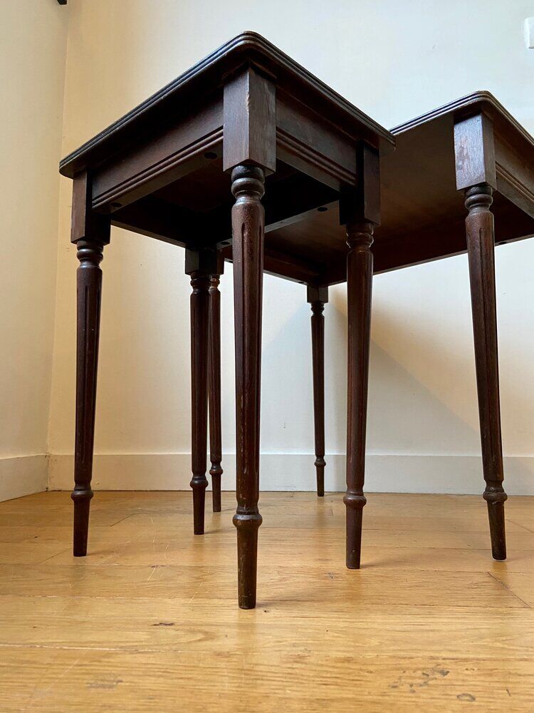 Dark wood and black leather tables