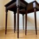 Dark wood and black leather tables