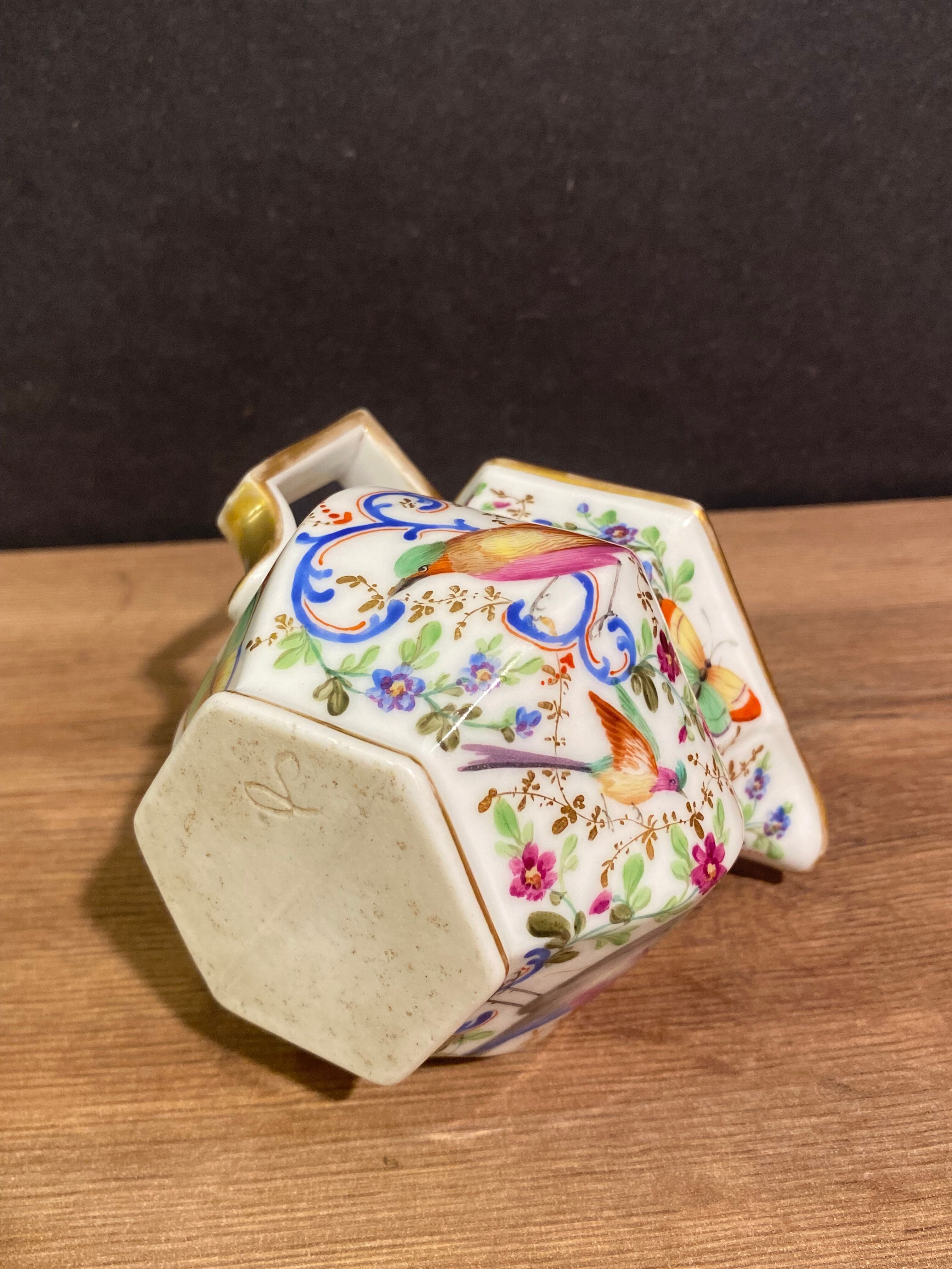 Old Paris porcelain milk jug with polychrome and gold bird floral decoration