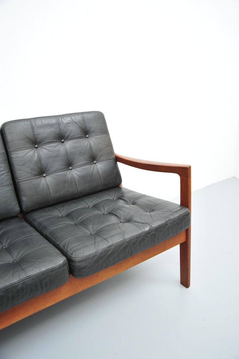 Senator sofa with black leather cushions by Ole Wascher for France and Son