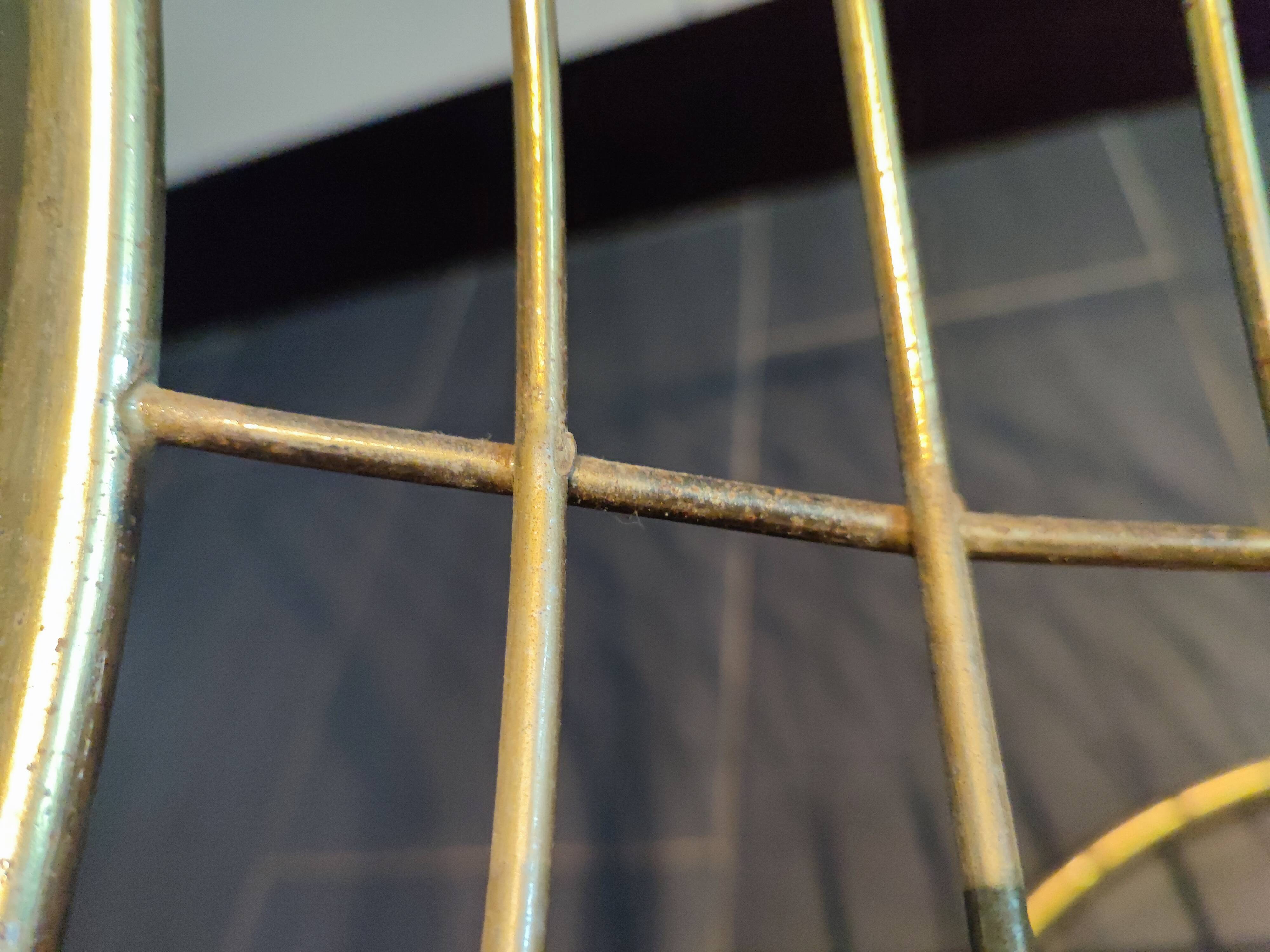 Tubular metal chair covered with gilding