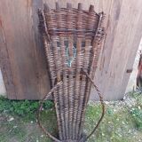 Old grape pickers basket woven wicker vintage wine vines decoration