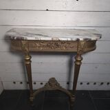 Louis XVI style console in gilded wood with a marble top.