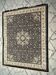 Classic navy blue living room rug decorated with flowers
