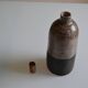 Ceramic bottle vase with a fish signature to be identified.