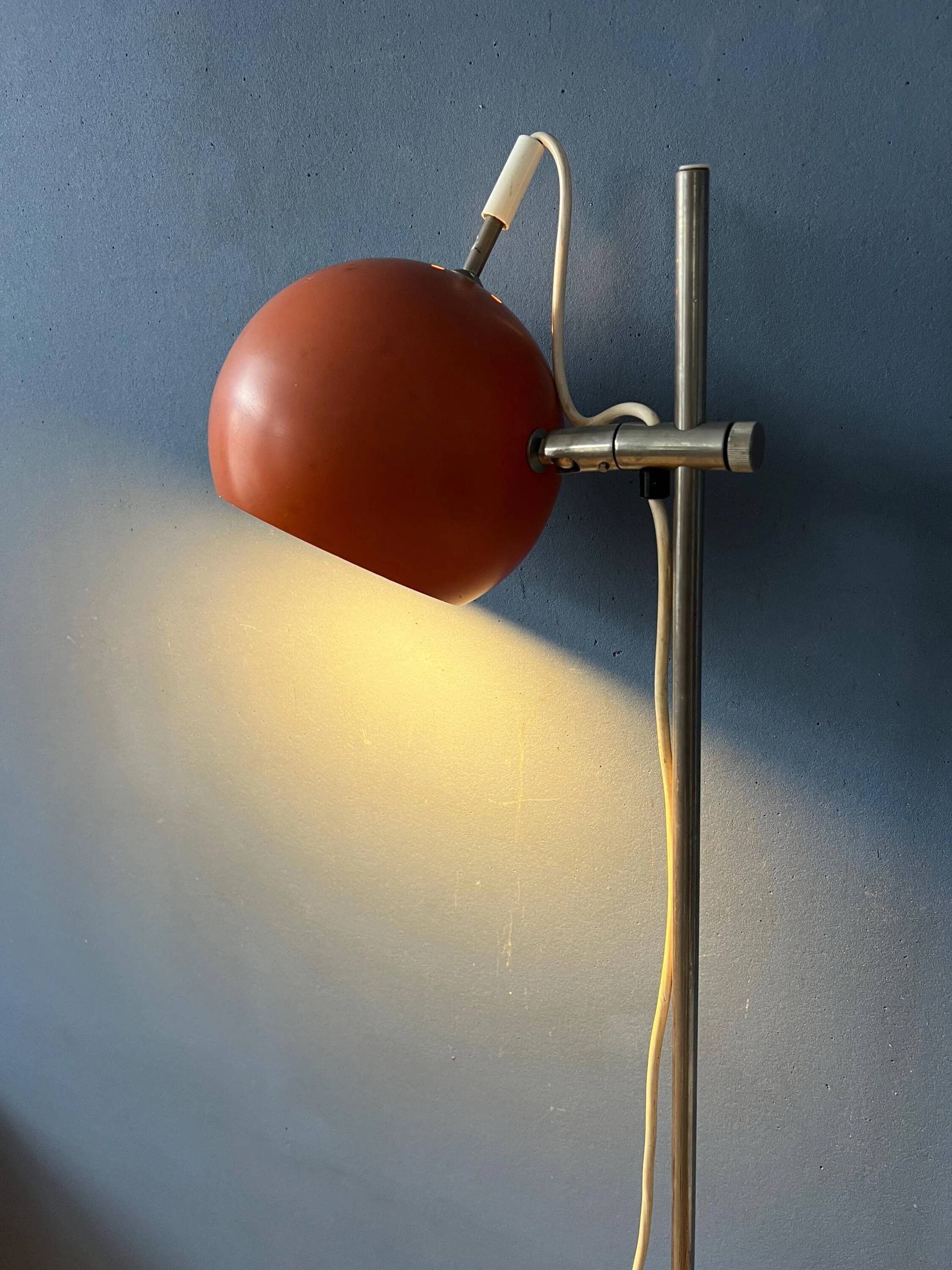 Mid-Century orange floor lamp with "eyeball" shade