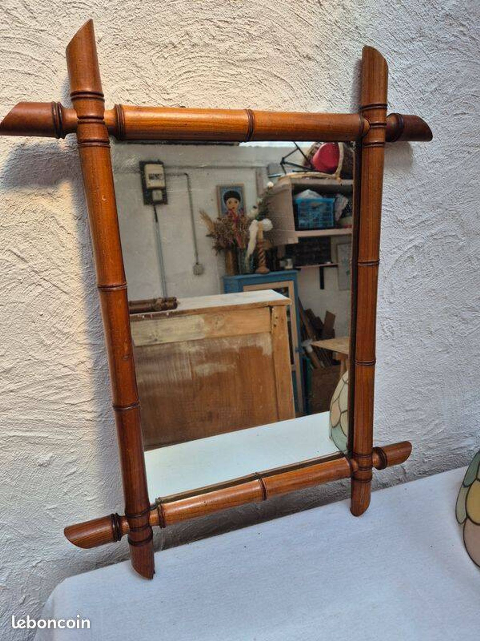 Vintage wooden mirror imitating bamboo