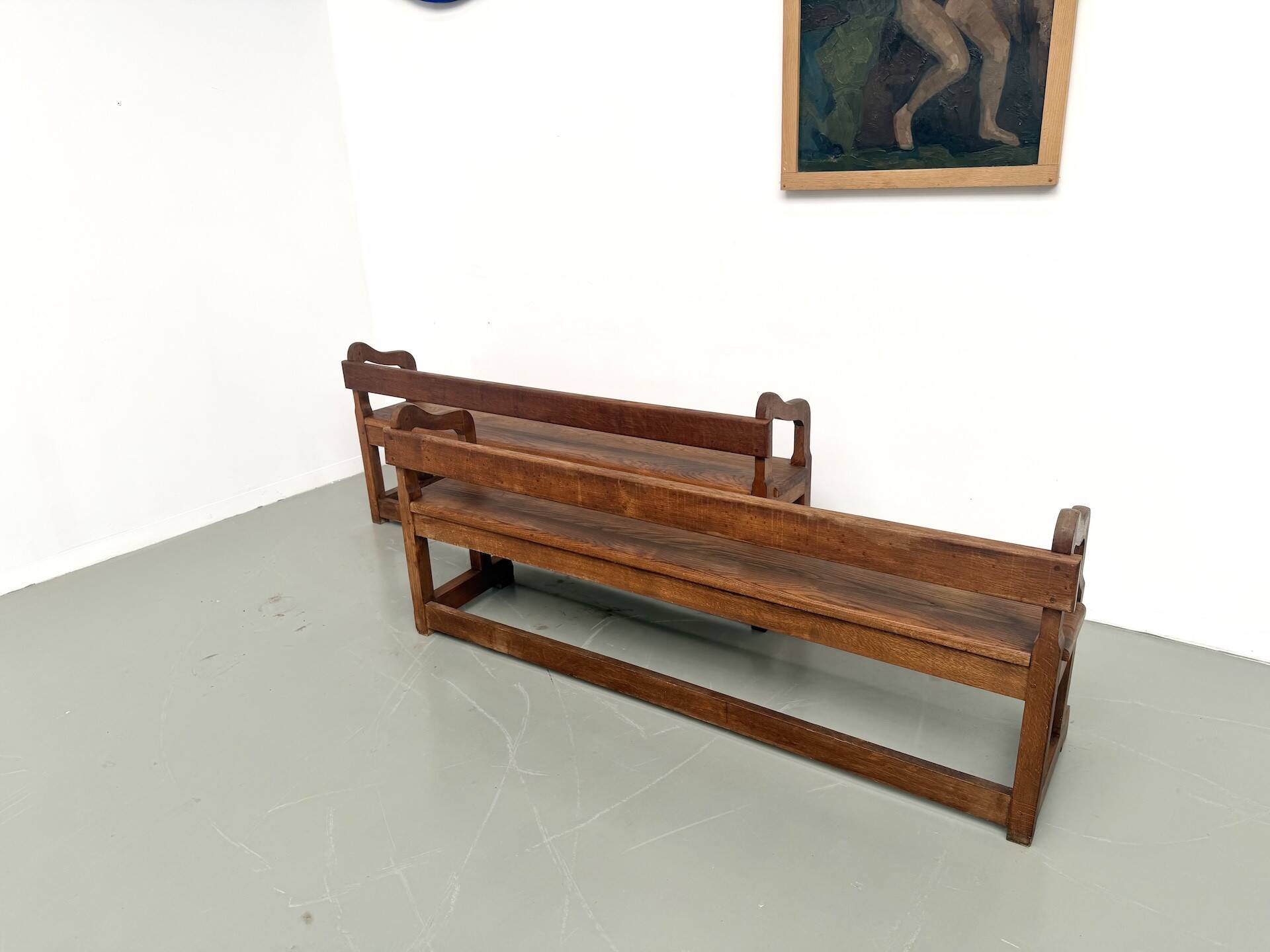 Pair of communal benches in solid oak, 1950s.
