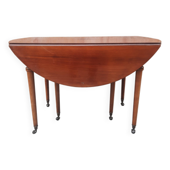 Extendable round drop-leaf table