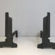 Pair of modernist chenets in cast iron and iron