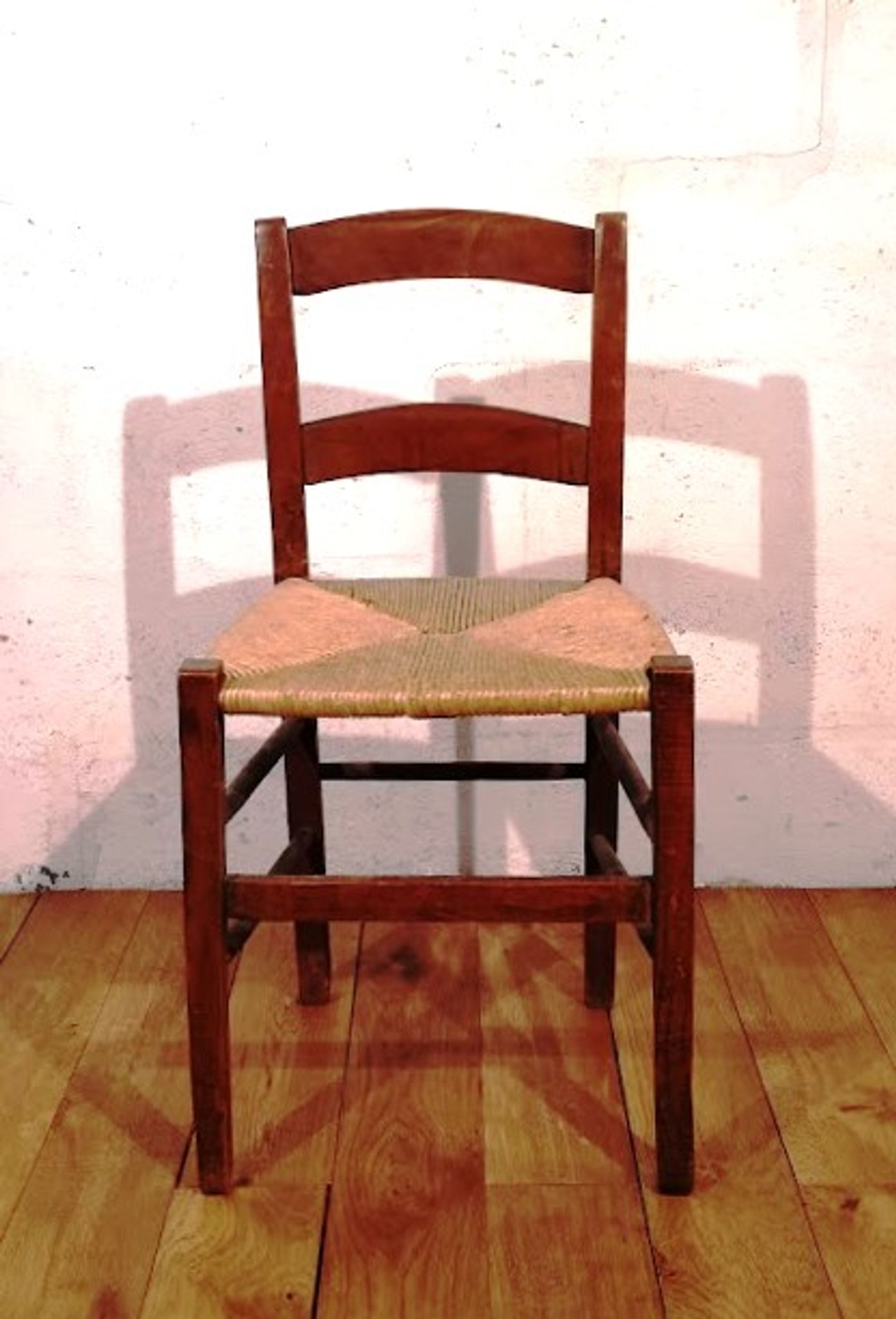 Vintage children's chair in wood and straw