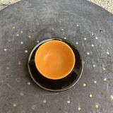 Coffee service composed of 5 cups and saucers in black earthenware and different colored interiors