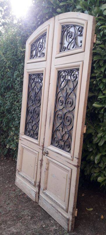 19th century double arched entrance door in oak with grilles and old glass